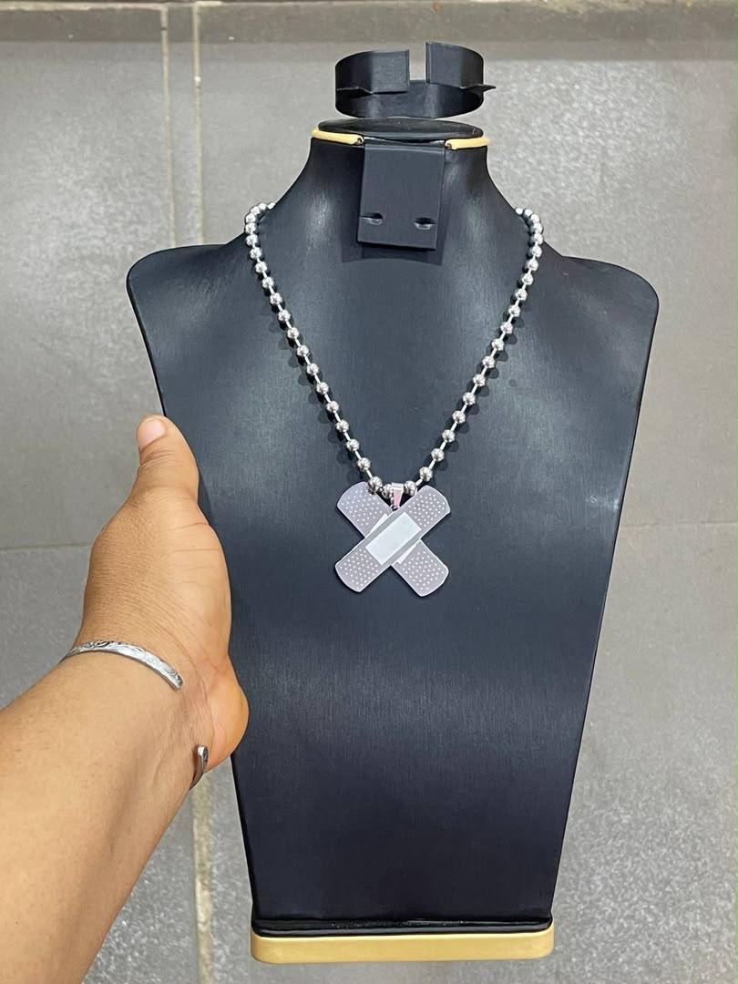 WhatsApp Image 2026-08-05 at 04.52.10 SGJ105 "Iyoo Cartel" Band-Aid Cross Necklace - Image 1